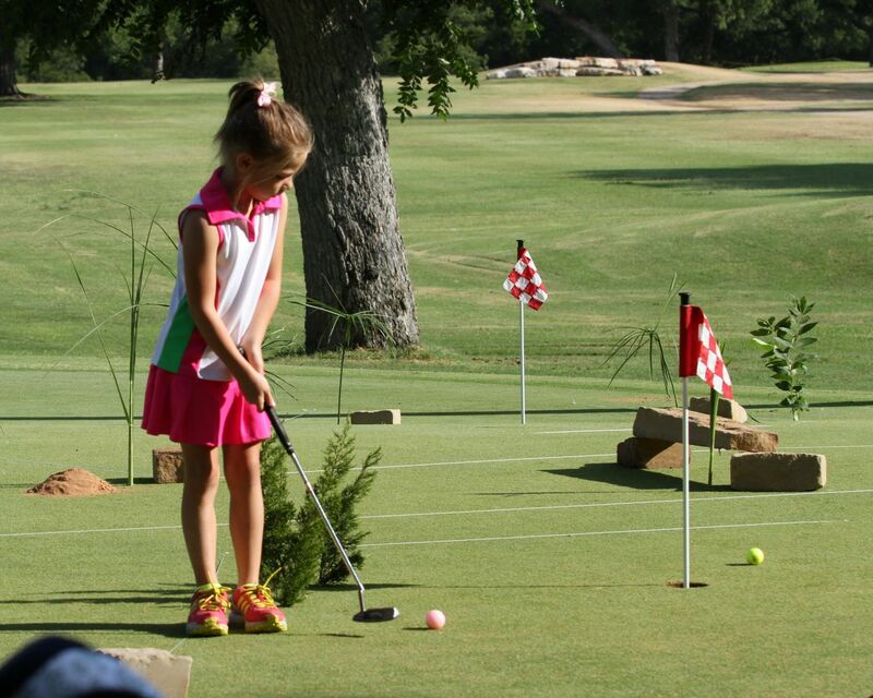 Junior golfer playing on the San Saba course