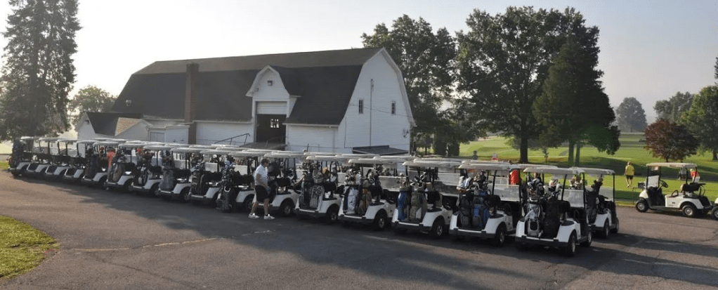line up of carts at course